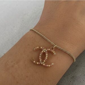 CHANEL Gold Bracelet with Pink and Rhinestone CC Charm